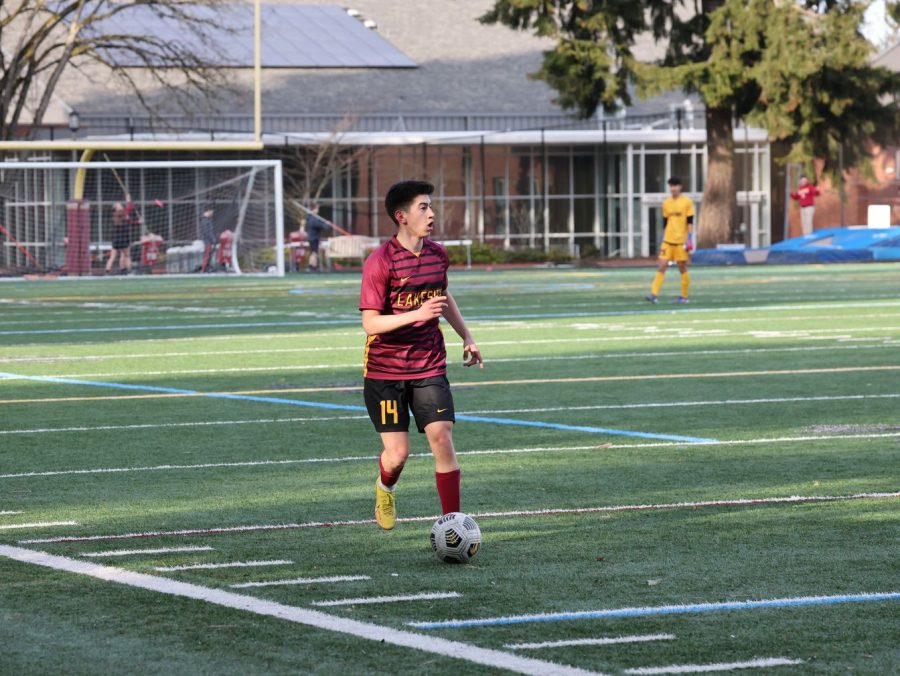 Center back Evan R. 24 takes center stage as he glances in amazement at the 23-0 scoreboard.(Mike Lengel)