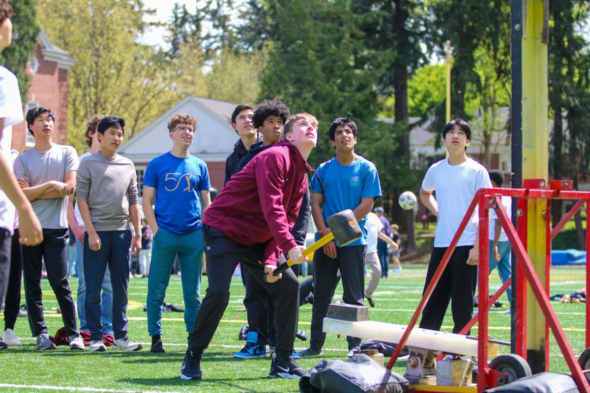 Freshmen play the hammer game at May Day.
