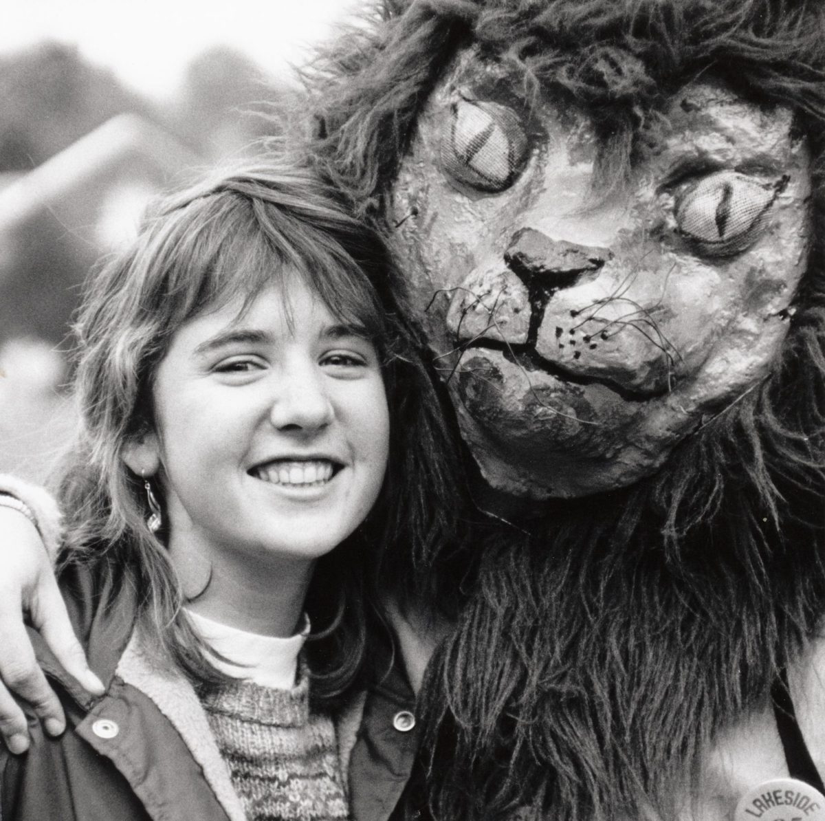 Alumni Ellen T. ’86 with an earlier version of the lion mascot costume.